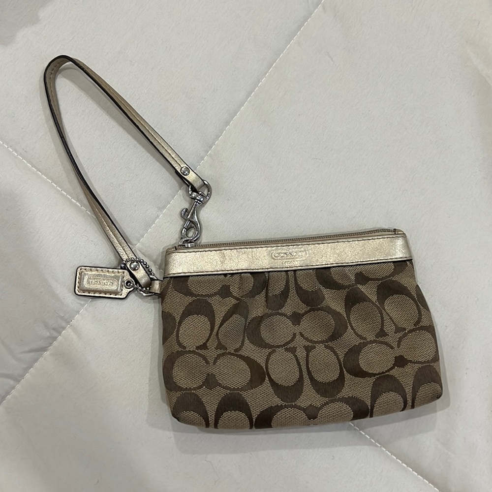 Coach original monogram wristlet.